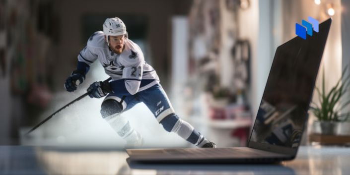 image of a hockey player and laptop on the table